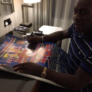 Frank signing poster